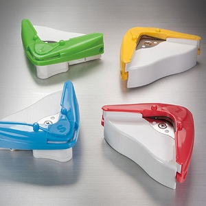 Corner cutters on a desk with cut cards